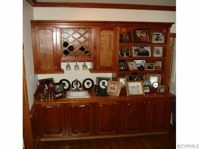1901 Thornleigh Road Midlothian, VA 23113 - Photo 6 of 9 a table with wine bottles and glasses on it
