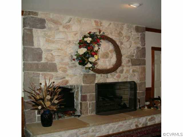 1901 Thornleigh Road Midlothian, VA 23113 - Photo 7 of 9 a living room with a fireplace