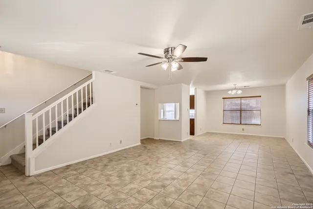 a view of an empty room with windows