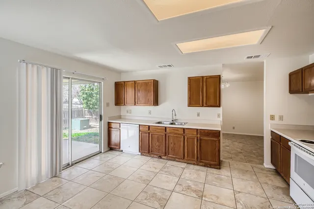 a large bathroom with a large mirror vanity and bathtub