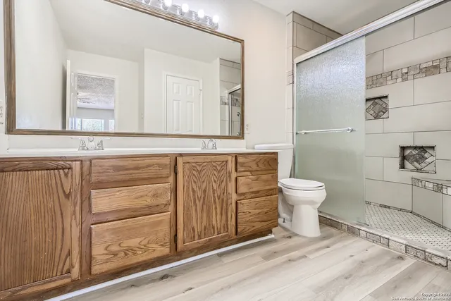 a bathroom with a toilet and a sink
