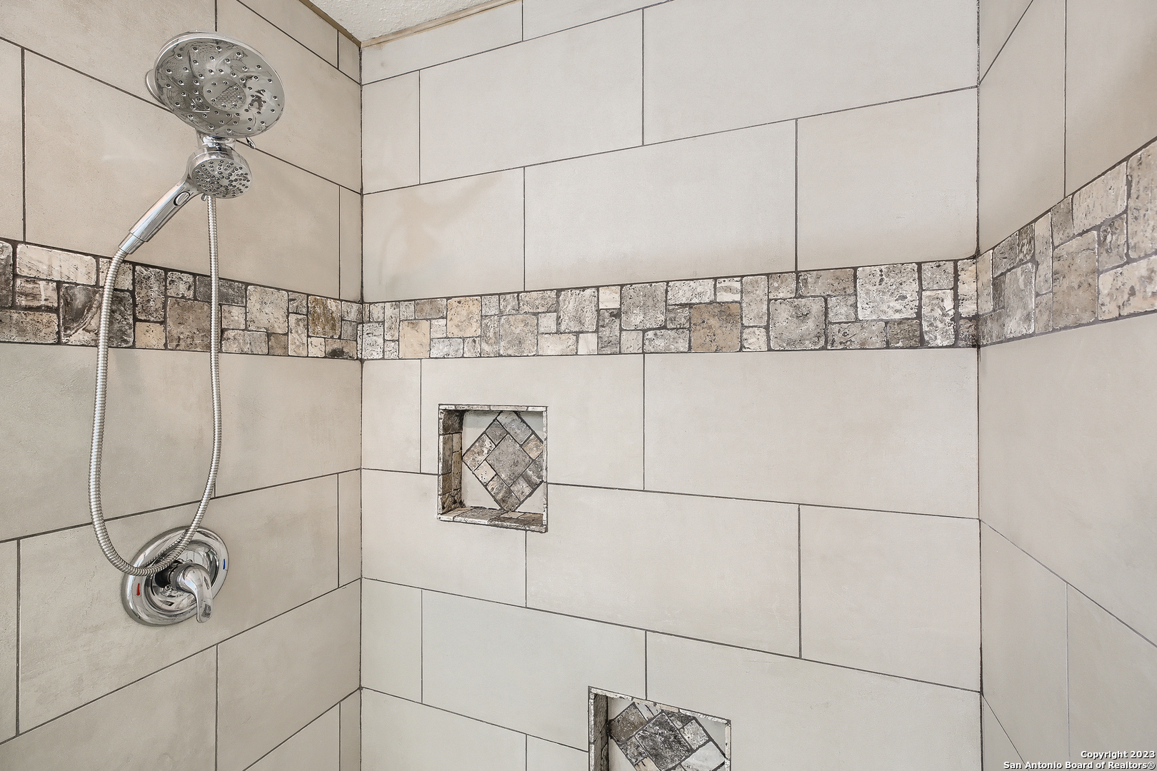 9655 Addersley Drive San Antonio, TX 78254 - Photo 8 of 20 a bathroom with a shower and a shower head