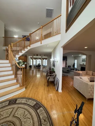 a view of a livingroom with furniture and hardwood floor