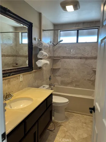 a view of a livingroom with furniture and windows