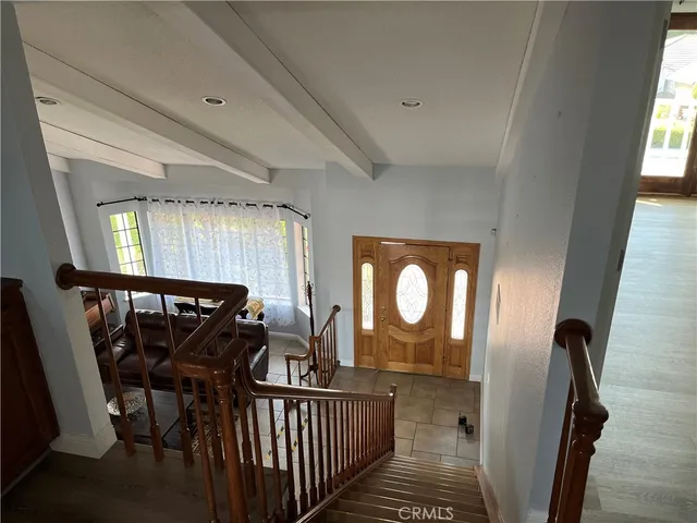 a living room with furniture cabinets and book shelf