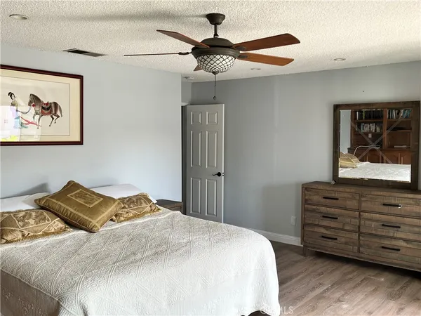 a kitchen with a table chairs stove and cabinets