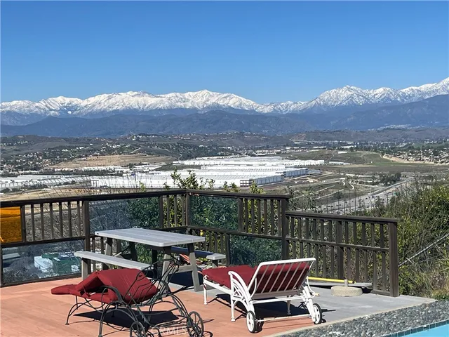 a view of a chairs and table in the patio