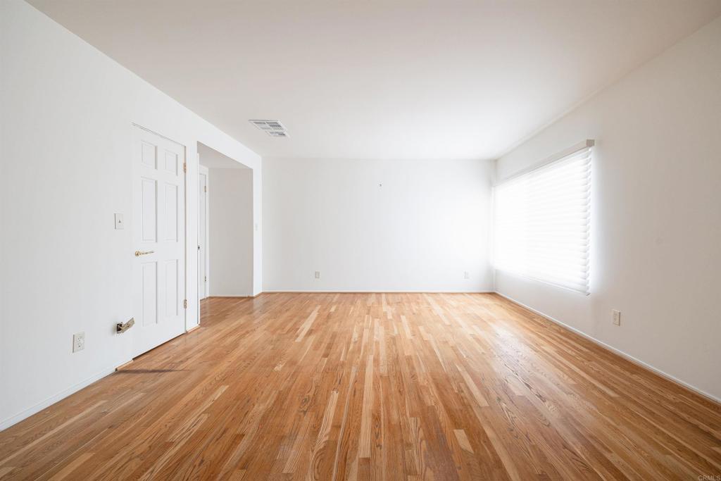 13236 Fiji Way, Unit L Marina del Rey, CA 90292 - Photo 11 of 20 an empty room with wooden floor