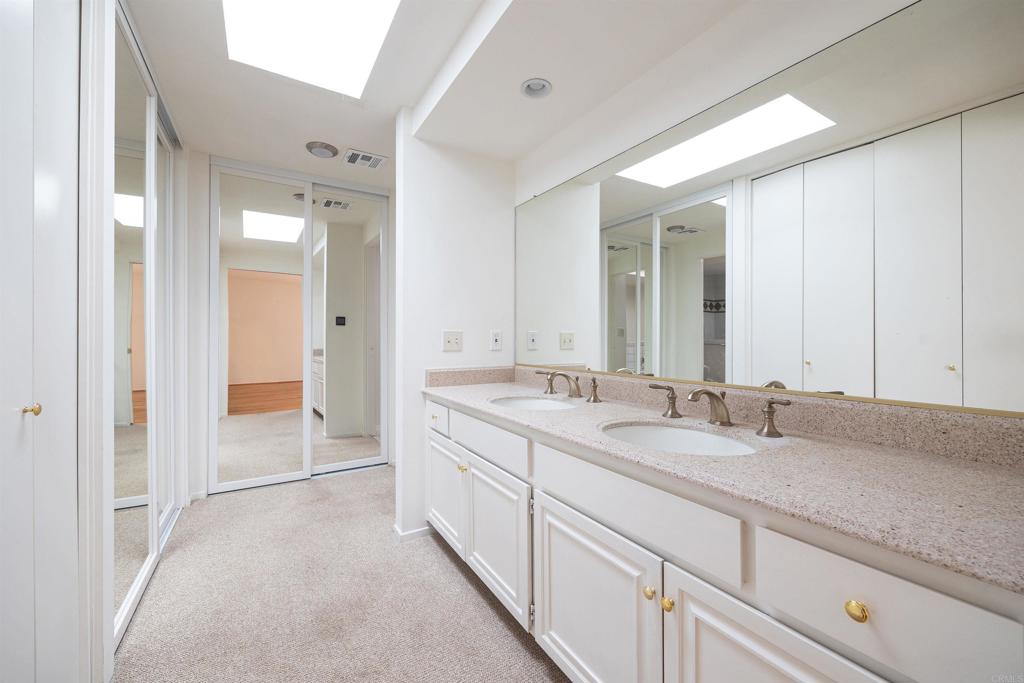 13236 Fiji Way, Unit L Marina del Rey, CA 90292 - Photo 13 of 20 a spacious bathroom with a granite countertop sink mirror and