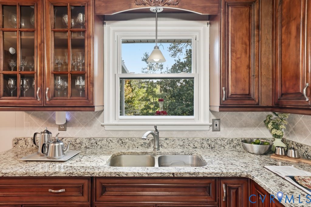 2701 Maury Road Petersburg, VA 23805 - Photo 12 of 41 a kitchen with granite countertop a sink and a window
