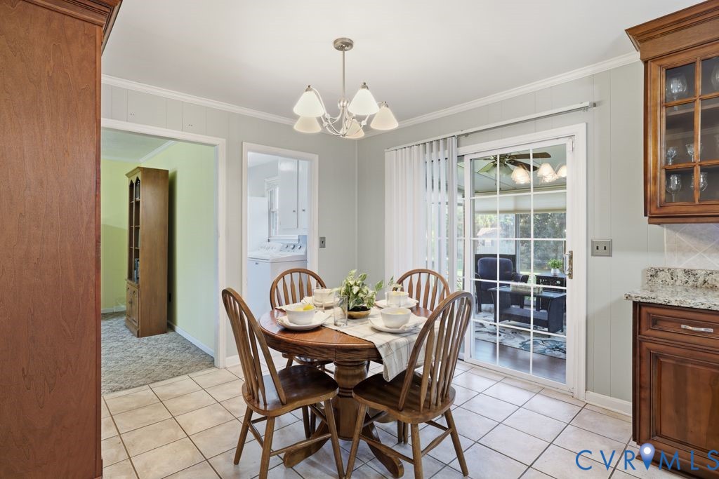 2701 Maury Road Petersburg, VA 23805 - Photo 15 of 41 a view of a dining room with furniture and chandelier