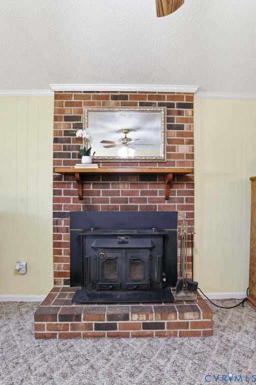 2701 Maury Road Petersburg, VA 23805 - Photo 20 of 41 a fireplace with a clock on top