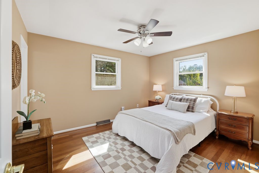2701 Maury Road Petersburg, VA 23805 - Photo 25 of 41 a bedroom with a bed and a chandelier