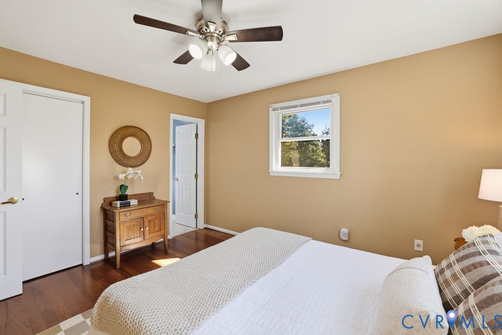 2701 Maury Road Petersburg, VA 23805 - Photo 27 of 41 a bedroom with a bed and dresser with wooden floor