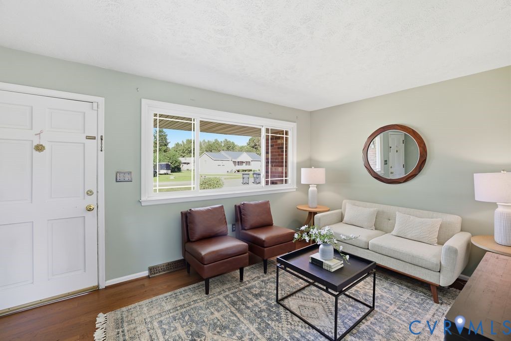 2701 Maury Road Petersburg, VA 23805 - Photo 9 of 41 a living room with furniture a rug and a window