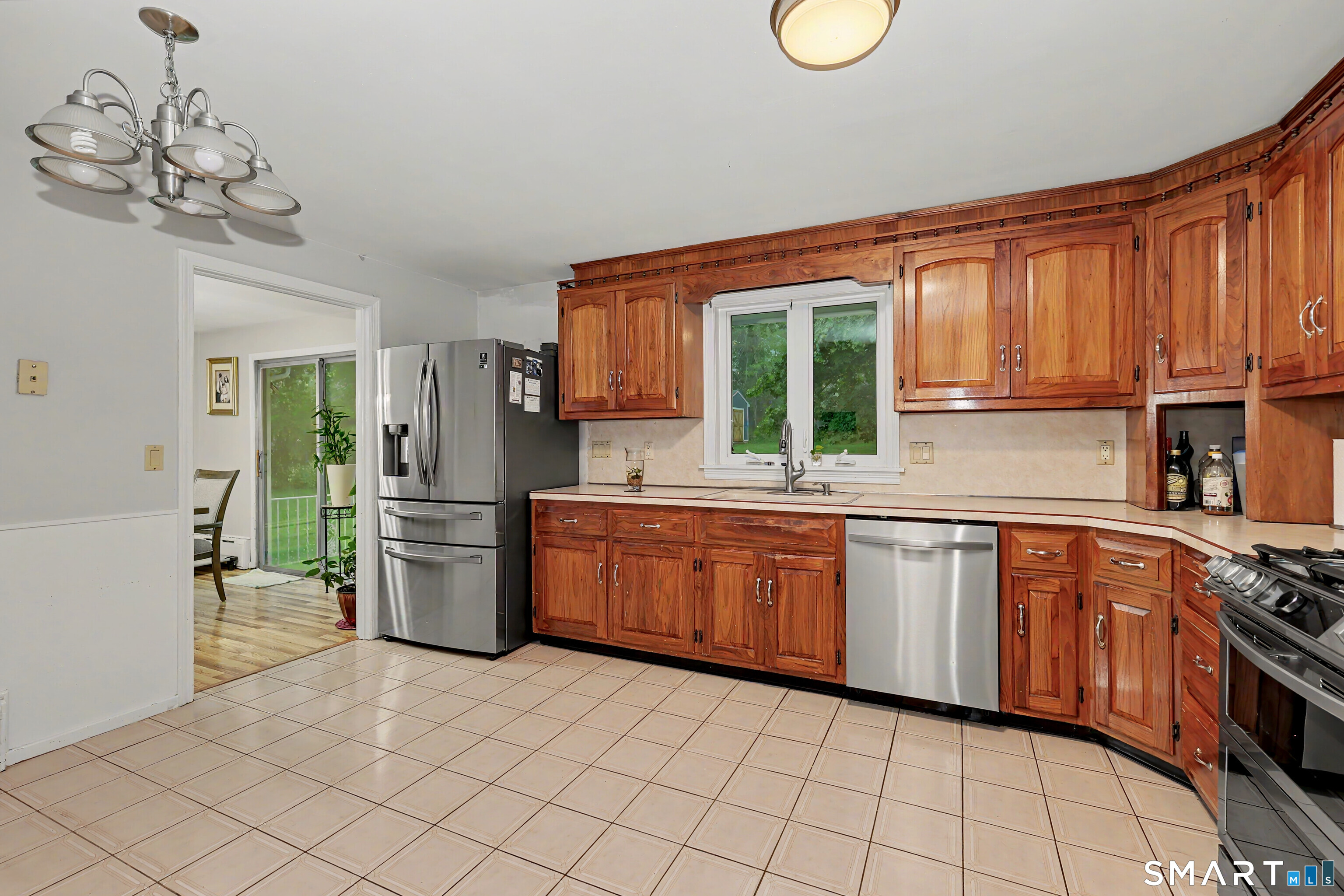 44 Haverhill Road Trumbull, CT 06611 - Photo 11 of 32 a kitchen with stainless steel appliances a refrigerator sink and cabinets