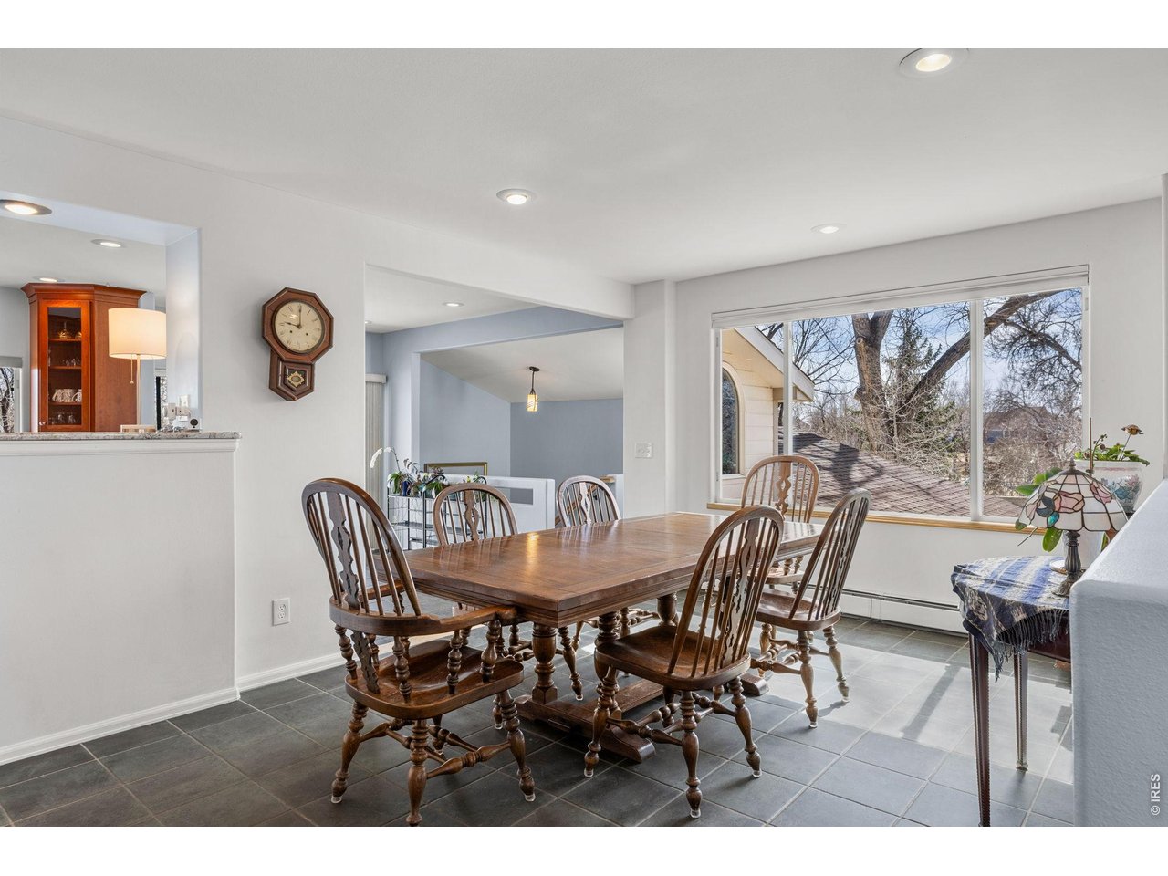 4490 Clay Street Boulder, CO 80301 - Photo 14 of 50 a view of a dining room and livingroom with furniture wooden floor and a clock