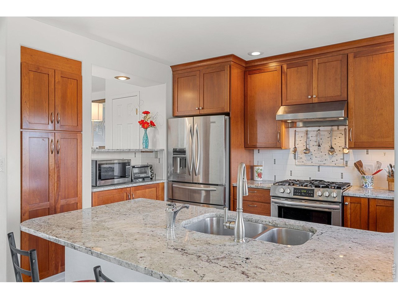 4490 Clay Street Boulder, CO 80301 - Photo 18 of 50 a kitchen with stainless steel appliances granite countertop a refrigerator and a sink