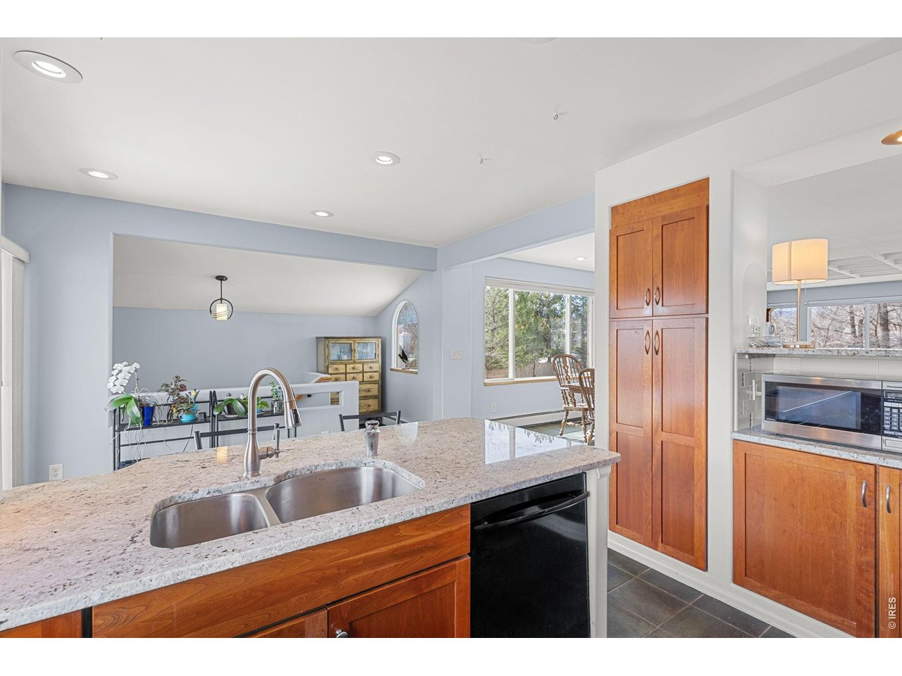 4490 Clay Street Boulder, CO 80301 - Photo 20 of 50 a kitchen with granite countertop a sink stove and refrigerator