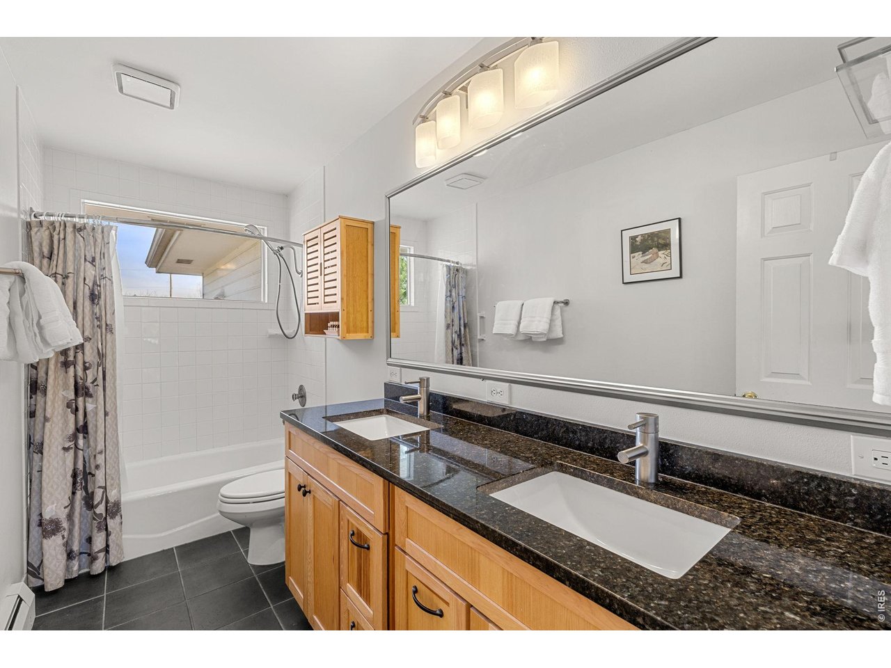 4490 Clay Street Boulder, CO 80301 - Photo 25 of 50 a bathroom with a sink a toilet a mirror and shower