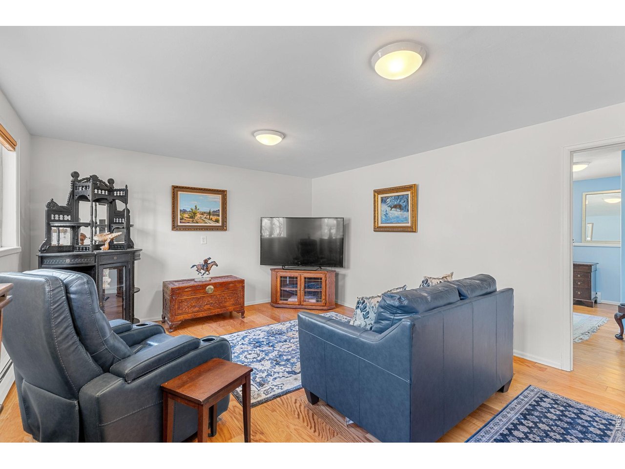 4490 Clay Street Boulder, CO 80301 - Photo 33 of 50 a living room with furniture and a flat screen tv