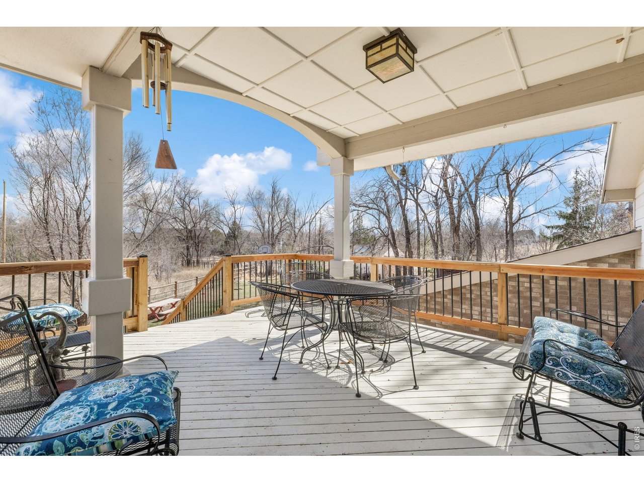 4490 Clay Street Boulder, CO 80301 - Photo 42 of 50 a view of a patio with dining table and chairs with wooden floor