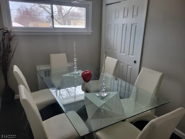 a view of a dining room with furniture window and outside view