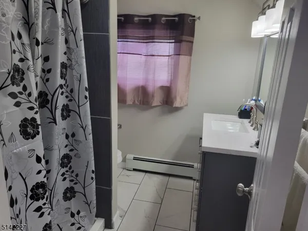 a bathroom with a sink and mirror