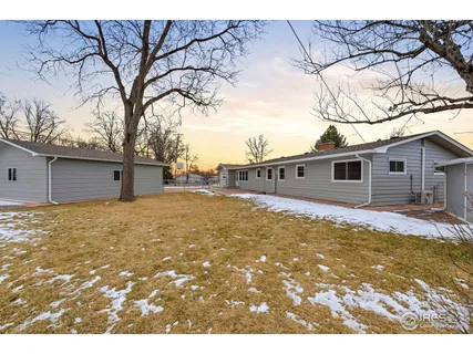 a view of a backyard of the house