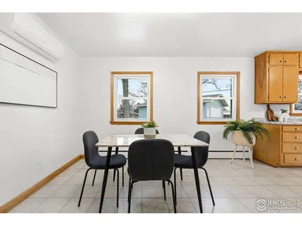 a kitchen with a refrigerator and a stove top oven