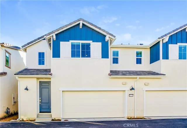 a front view of a house with yard