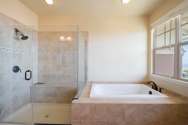 a view of a storage and utility room with washer and dryer