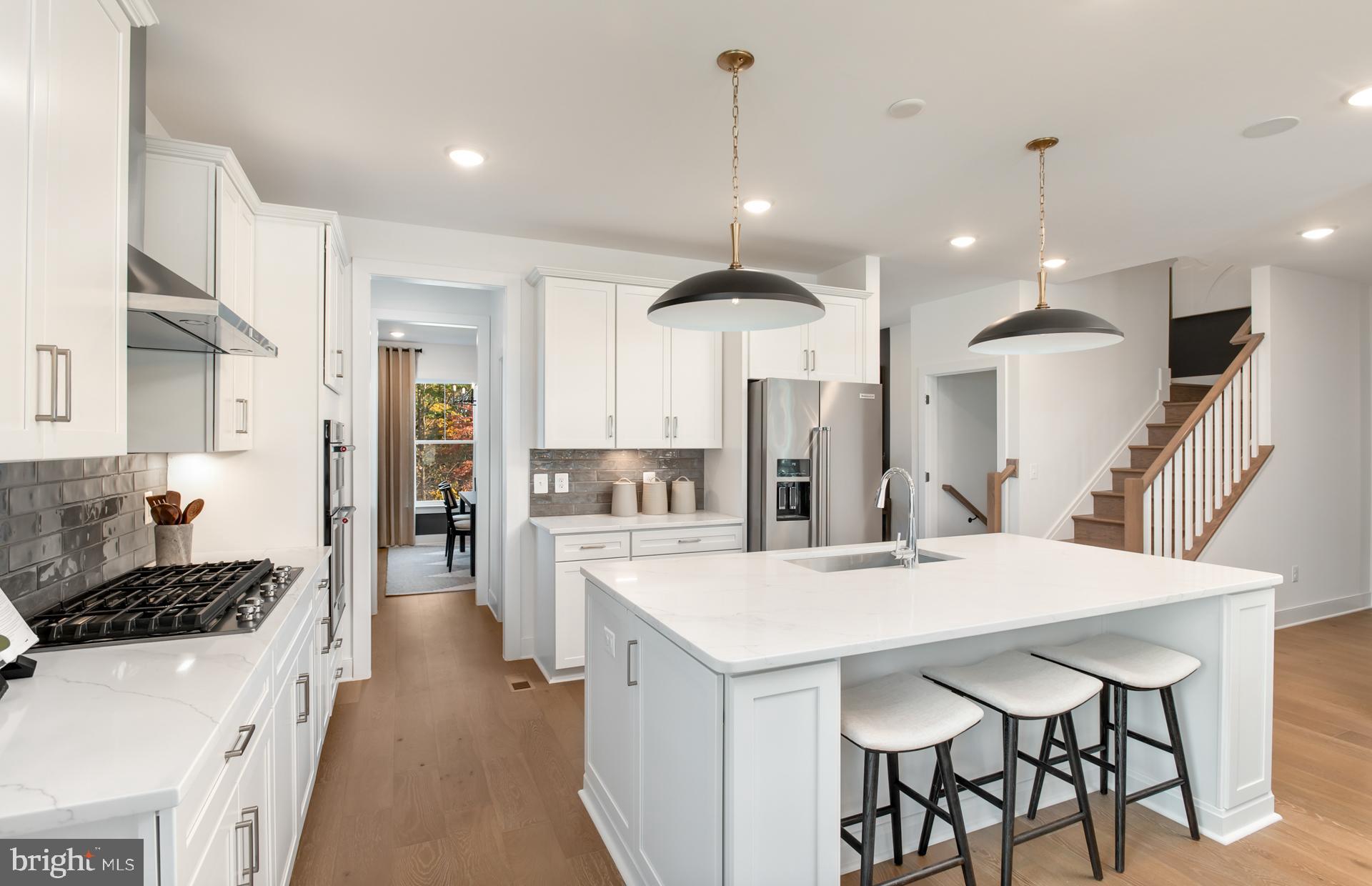 18283 Cresswell Rst Lane Leesburg, VA 20176 - Photo 14 of 63 a kitchen with a table and chairs in it