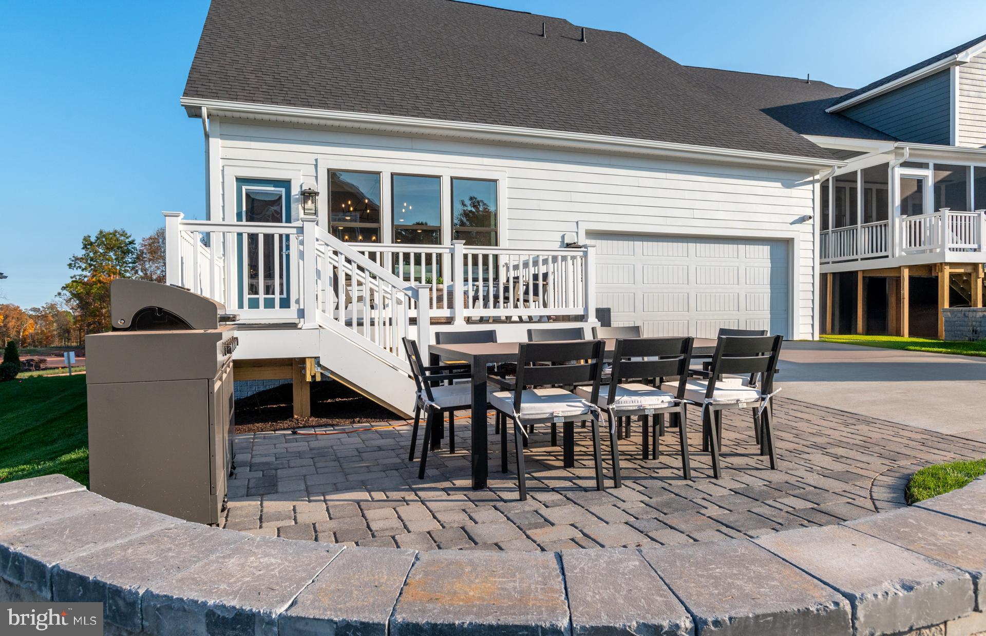 18283 Cresswell Rst Lane Leesburg, VA 20176 - Photo 46 of 63 a view of a house with a deck and furniture