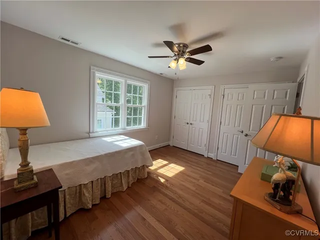 a bed room with a bed window and dresser