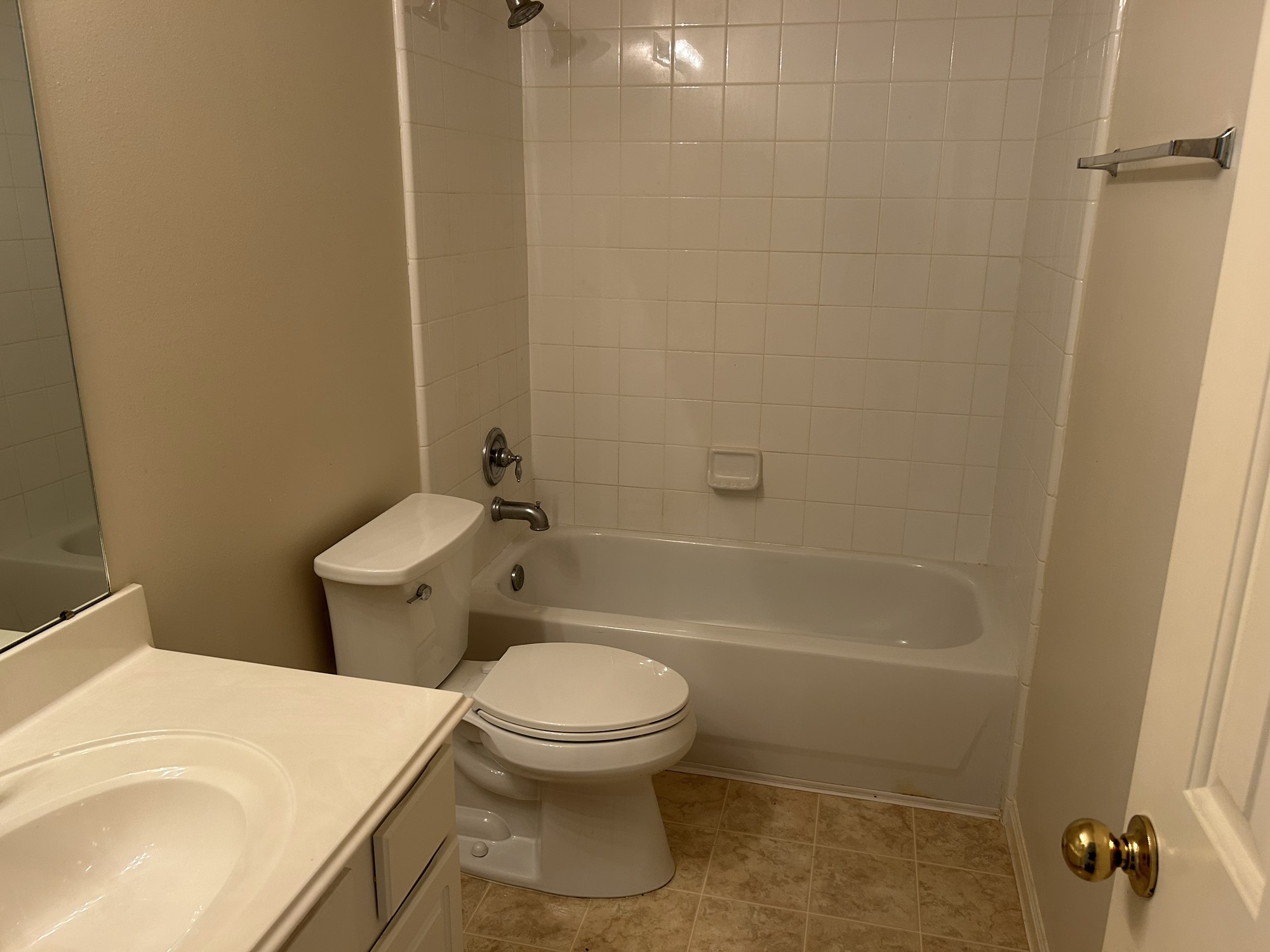 5119 Spring Oak Drive Pasadena, TX 77505 - Photo 11 of 11 a white toilet sitting next to a bath tub