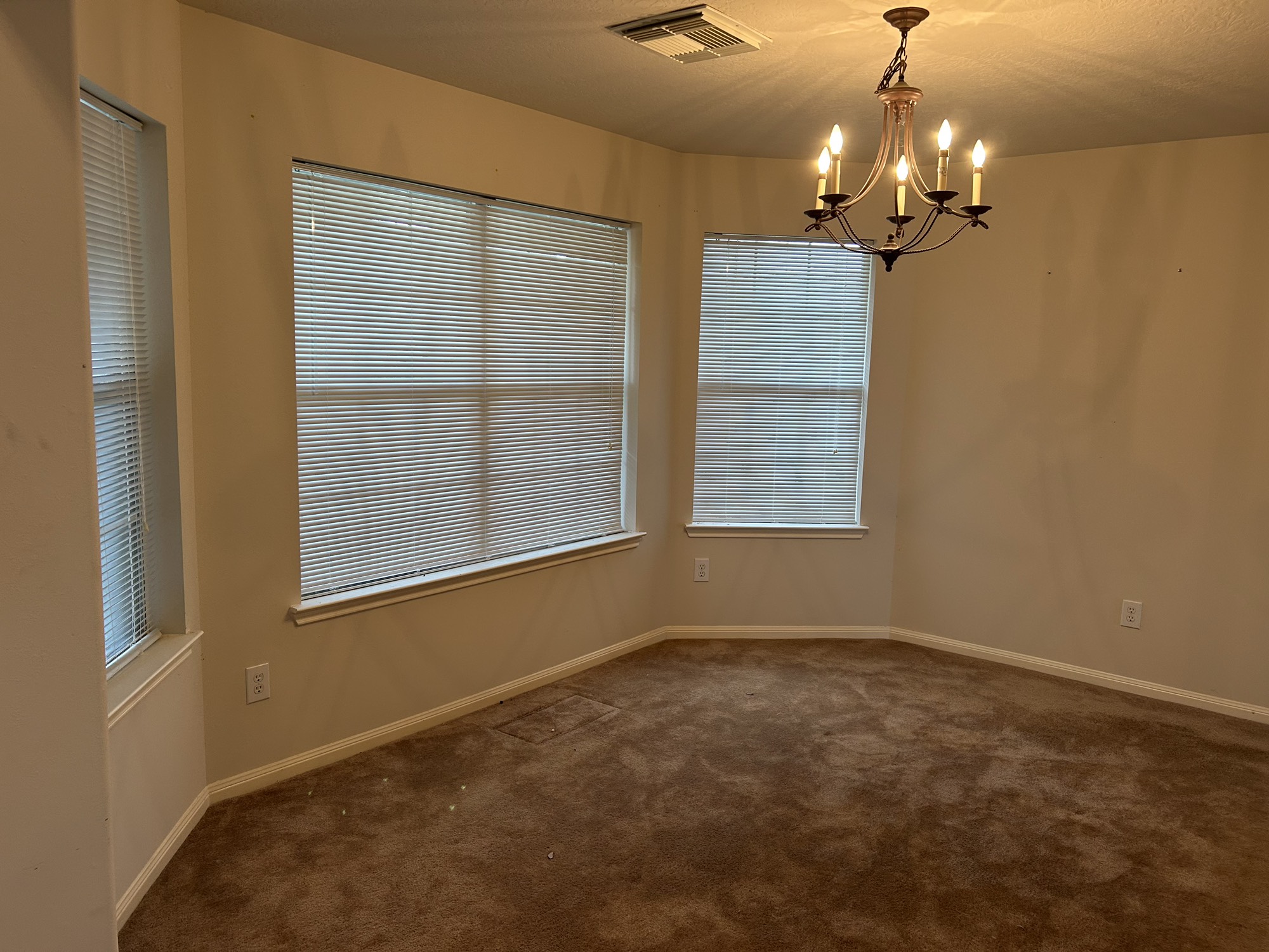 5119 Spring Oak Drive Pasadena, TX 77505 - Photo 2 of 11 wooden floor in an empty room with a window
