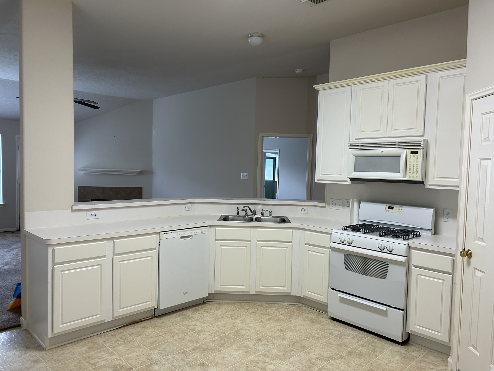 5119 Spring Oak Drive Pasadena, TX 77505 - Photo 7 of 11 a kitchen with a sink stove and cabinets