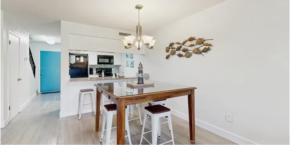11 Dondanville Road, Unit 33 St. Augustine, FL 32080 - Photo 5 of 16 a view of a kitchen with a sink and refrigerator