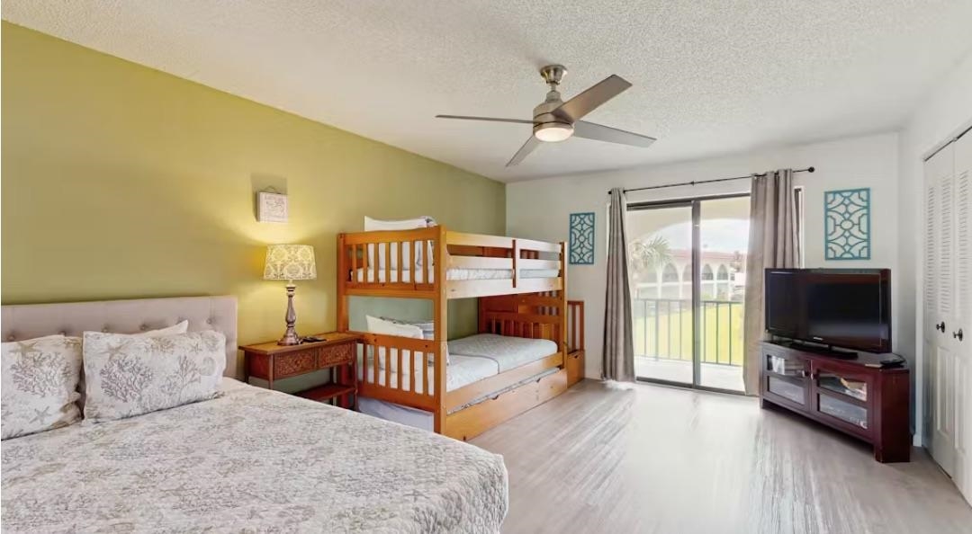 11 Dondanville Road, Unit 33 St. Augustine, FL 32080 - Photo 9 of 16 a bedroom with a bed and a flat tv screen on dresser