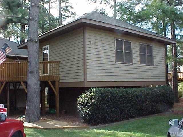 3261 Mill Run Raleigh, NC 27612 - Photo 1 of 1 a front view of a house with garden