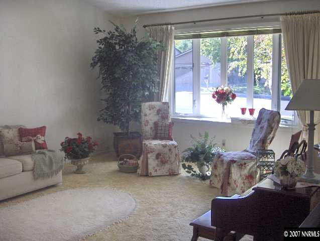 4870 Warren Way Reno, NV 89509 - Photo 3 of 8 a room with furniture and a large window