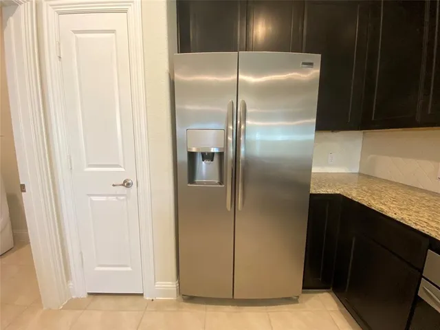 a view of a kitchen with microwave and cabinets