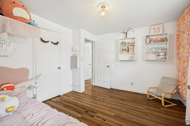 1215 8th Street Ogden, UT 84404 - Photo 19 of 39 Wood-finish flooring throughout, white baseboards, and white walls