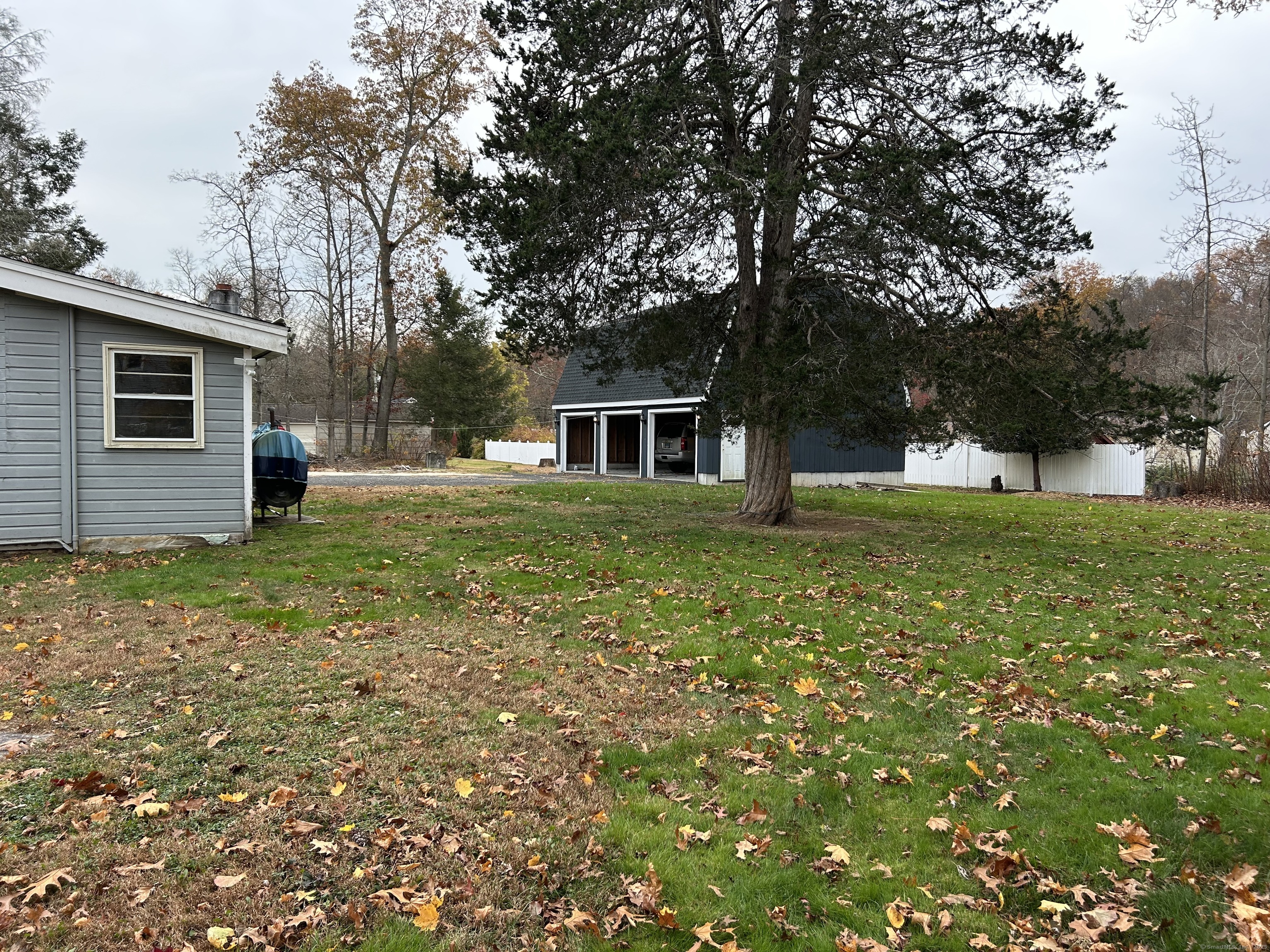 5 Shepaug Road Newtown, CT 06482 - Photo 18 of 20 a house view with a garden space