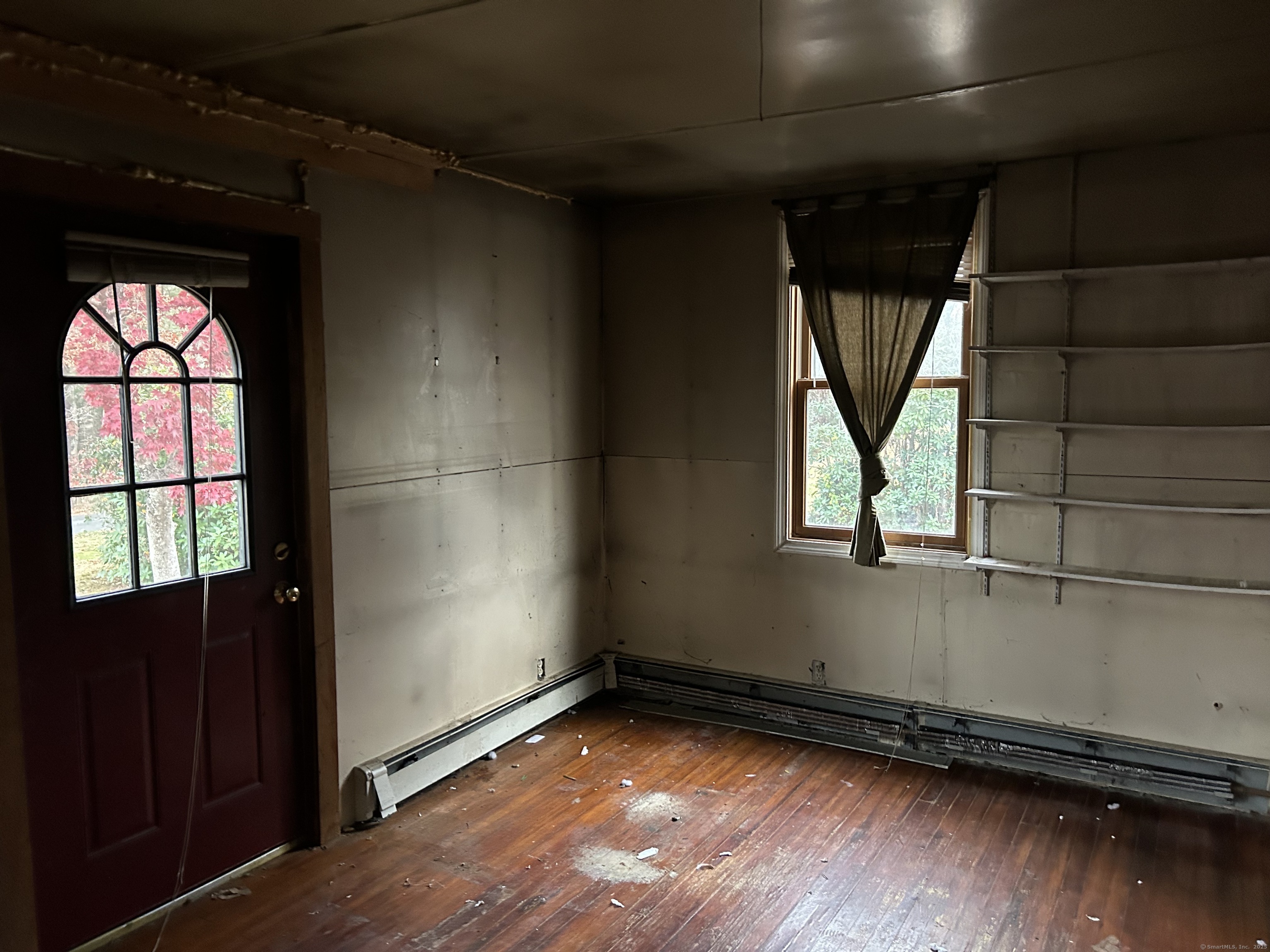 5 Shepaug Road Newtown, CT 06482 - Photo 6 of 20 an empty room with wooden floor and windows