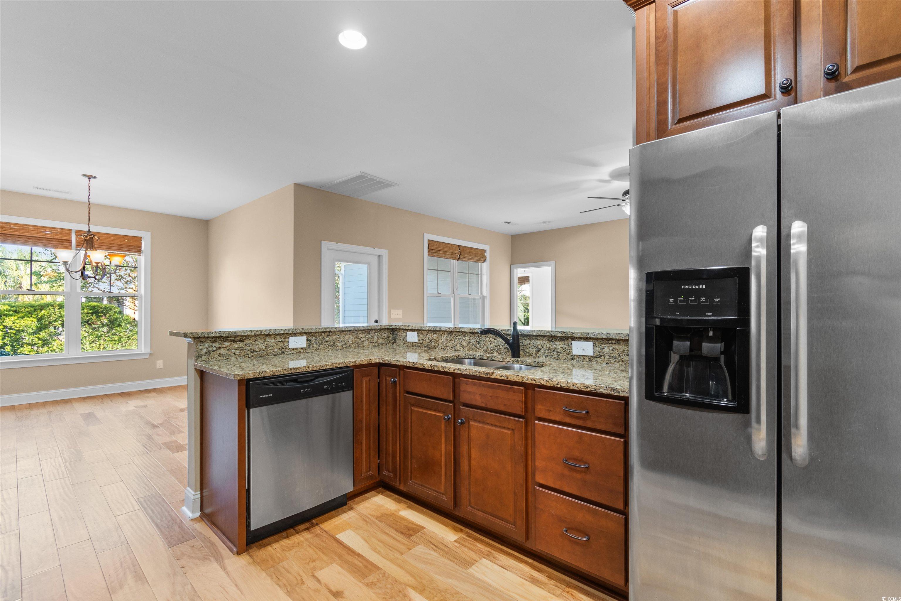 373 Graytwig Circle Murrells Inlet, SC 29576 - Photo 12 of 39 Kitchen with light stone countertops, sink, applia