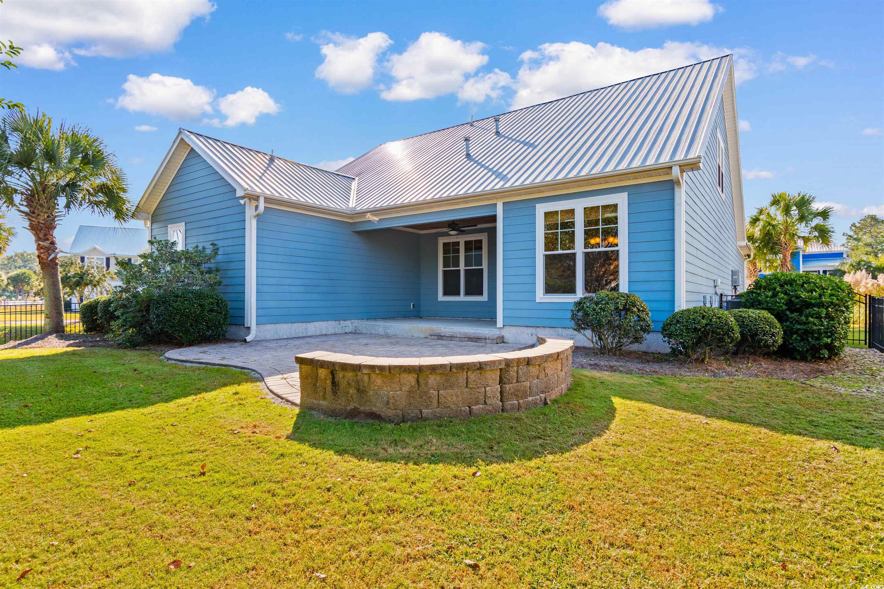 373 Graytwig Circle Murrells Inlet, SC 29576 - Photo 16 of 39 Back of property with a patio, a lawn, and ceiling