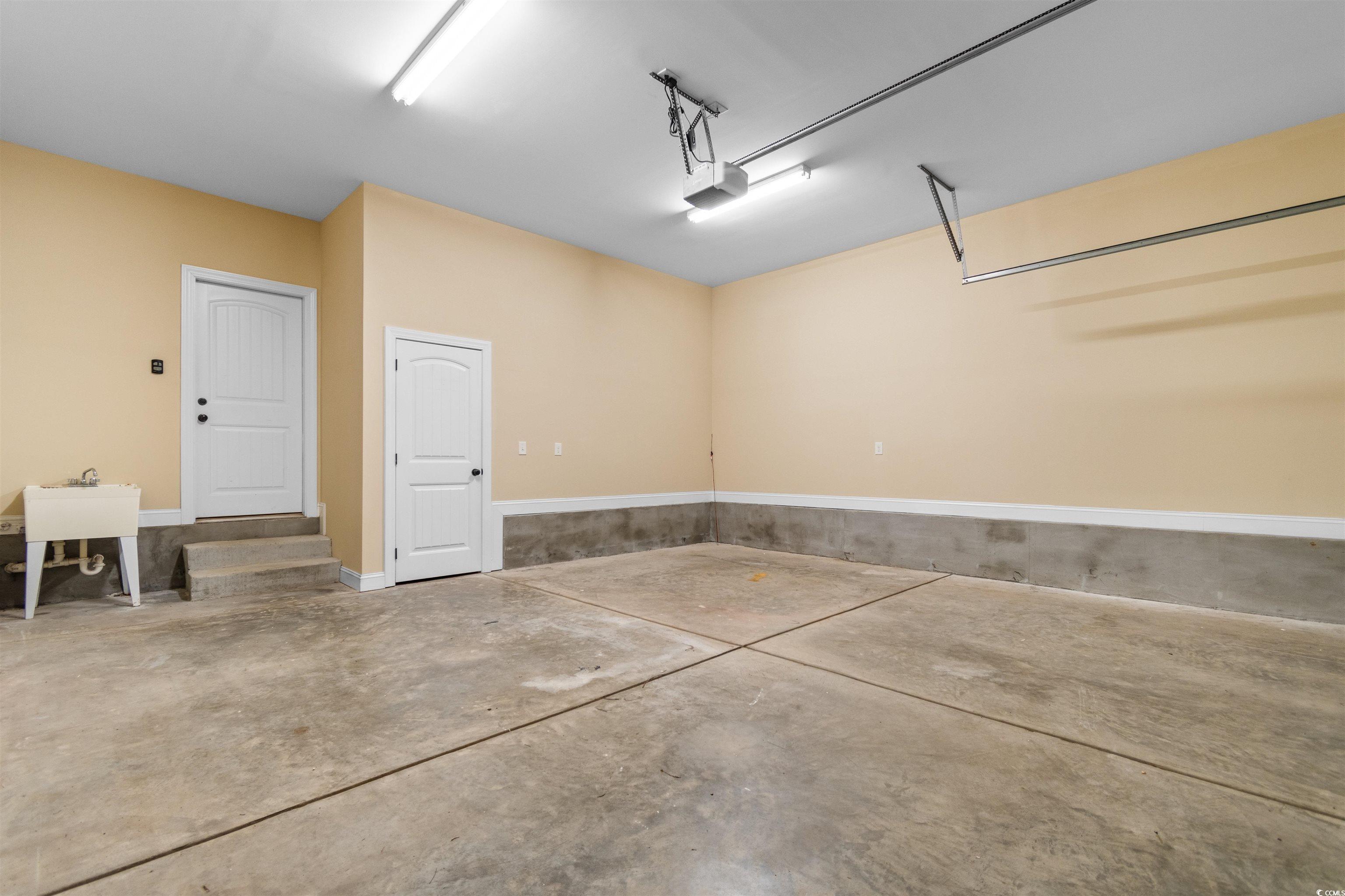 373 Graytwig Circle Murrells Inlet, SC 29576 - Photo 27 of 39 Garage featuring a garage door opener