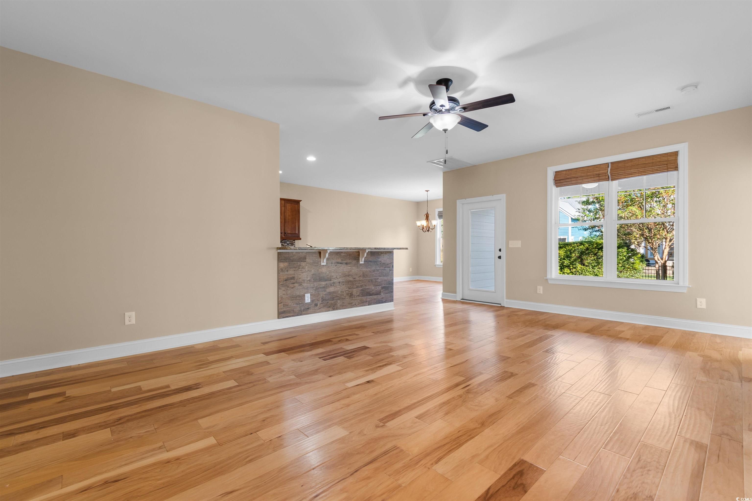 373 Graytwig Circle Murrells Inlet, SC 29576 - Photo 6 of 39 Unfurnished living room featuring ceiling fan with